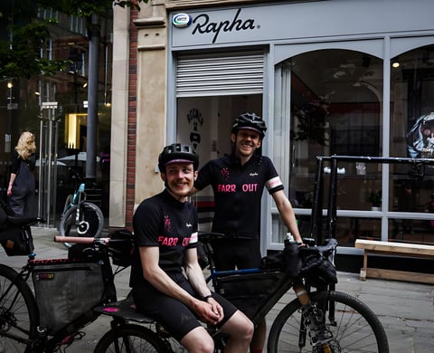 Two Farr Out Deliveries riders with the Rothair cargo bike outside Rapha Manchester at the Pennine Rally finish.