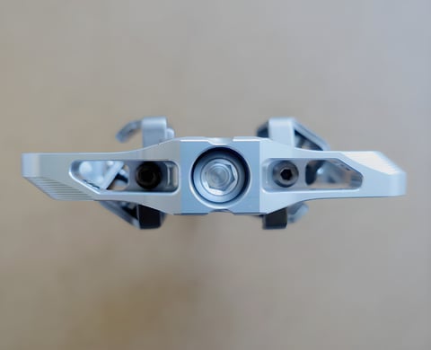 Hope Union Trail clipless pedal in silver, viewed end-on along the axle.