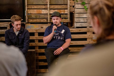 Nathan Hughes of Restrap speaks into a microphone during the bag makers panel at Bespoked 2021.