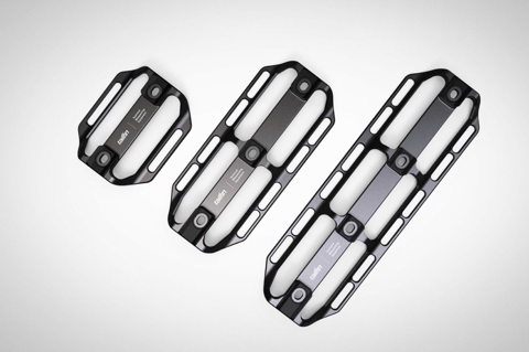 Three black Tailfin Cargo Cages from the range, the Mini Cage at left beside two longer cages.