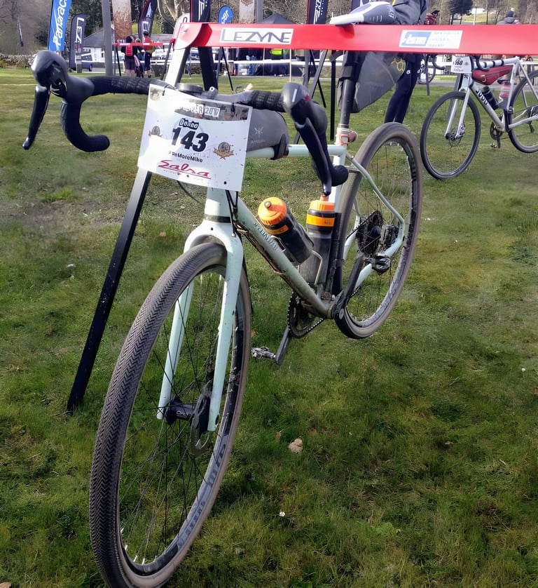 Specialized Sequoia gravel bike with 42c tyres and race number 143 at the Dirty Reiver, bottles on the frame.