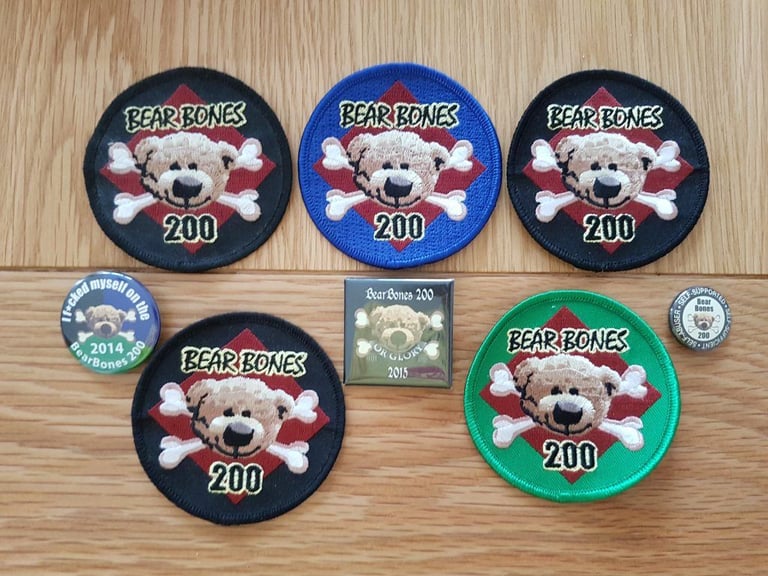 Embroidered Bear Bones 200 finisher badges in black, blue and green, with 2014 and 2015 pin badges.
