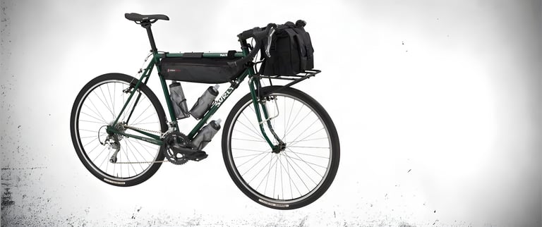 Green Surly Pack Rat loaded with a frame bag, three bottles and a front-rack bag, side view.