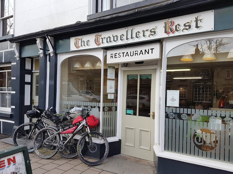 Bikepacking bikes parked outside The Travellers Rest restaurant in Llanidloes during the Café Racer ride.
