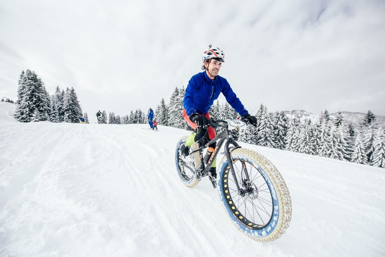 Scott Cornish grins on his Trek Farley fatbike on Stage 1 of the Snow Bike Festival in the Swiss Alps.