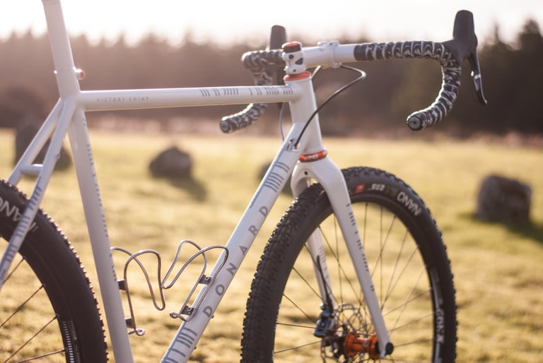 Front three-quarter view of the Donard x Victory Chimp bike with Ogham-inspired paint, drop bars and WTB Nano tyres.