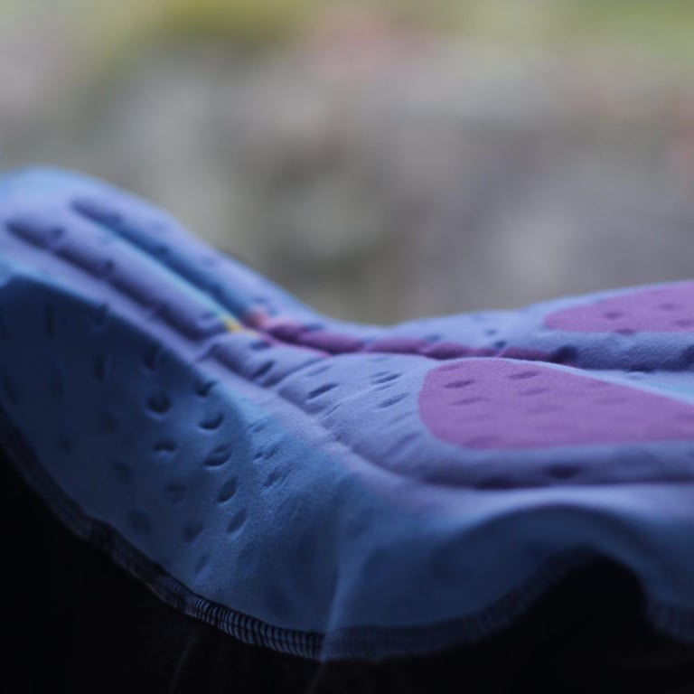 Close-up of the blue and purple endurance chamois pad inside the Galibier Classique Bib Shorts.