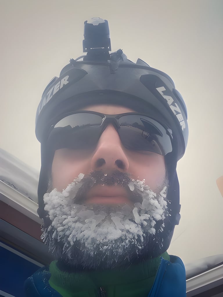 Simon Bryant in a Lazer helmet and sunglasses, his beard frosted with ice during the Rovaniemi fat bike race.