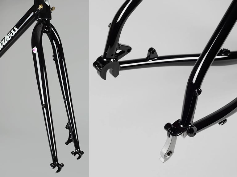 Close-ups of the black Vulture steel fork and rear dropout, with rack and mudguard mounts and a replaceable hanger.