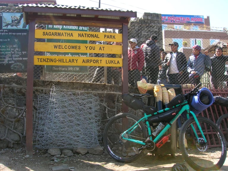 Pinnacle Ramin mountain bike with bikepacking bags at the Tenzing-Hillary Airport entrance in Lukla, Nepal.