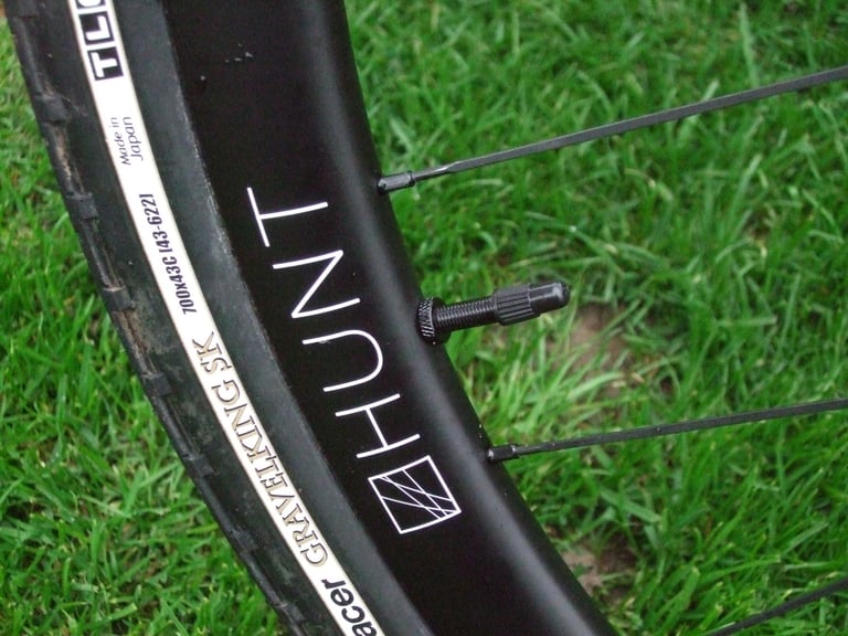 Valve and sidewall label of a Panaracer Gravel King SK 700x43C tyre fitted to a Hunt 30 Carbon Gravel rim.