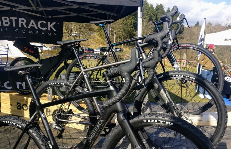 Black Bombtrack gravel bikes with WTB tyres lined up under the brand's tent at the Dirty Reiver Gravel Expo.