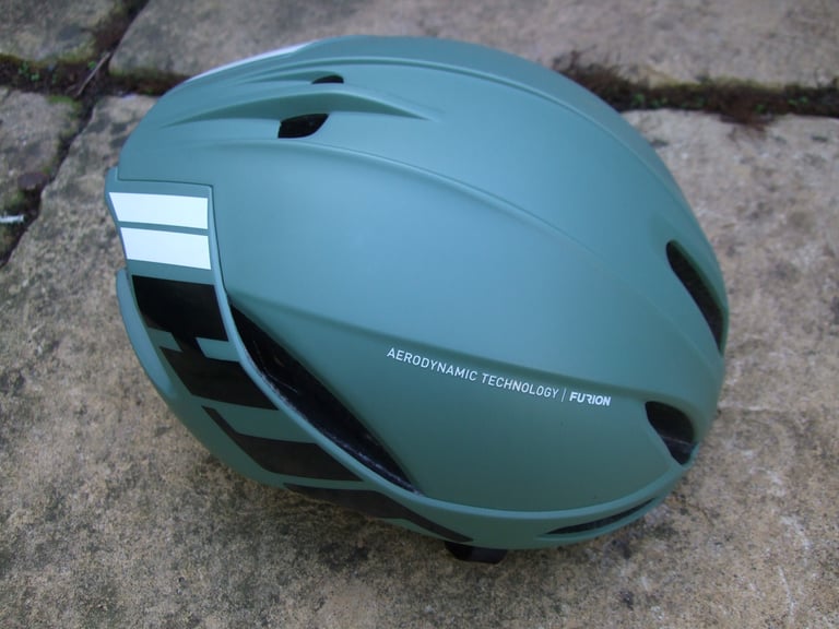 HJC Furion helmet in Matte Olive from the side, with few vents on top and reflective rear stripes.