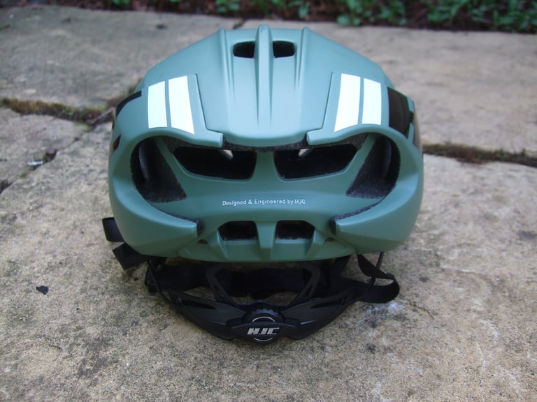 Rear of the HJC Furion helmet showing its large exhaust ports, reflective strips and dial fit system.