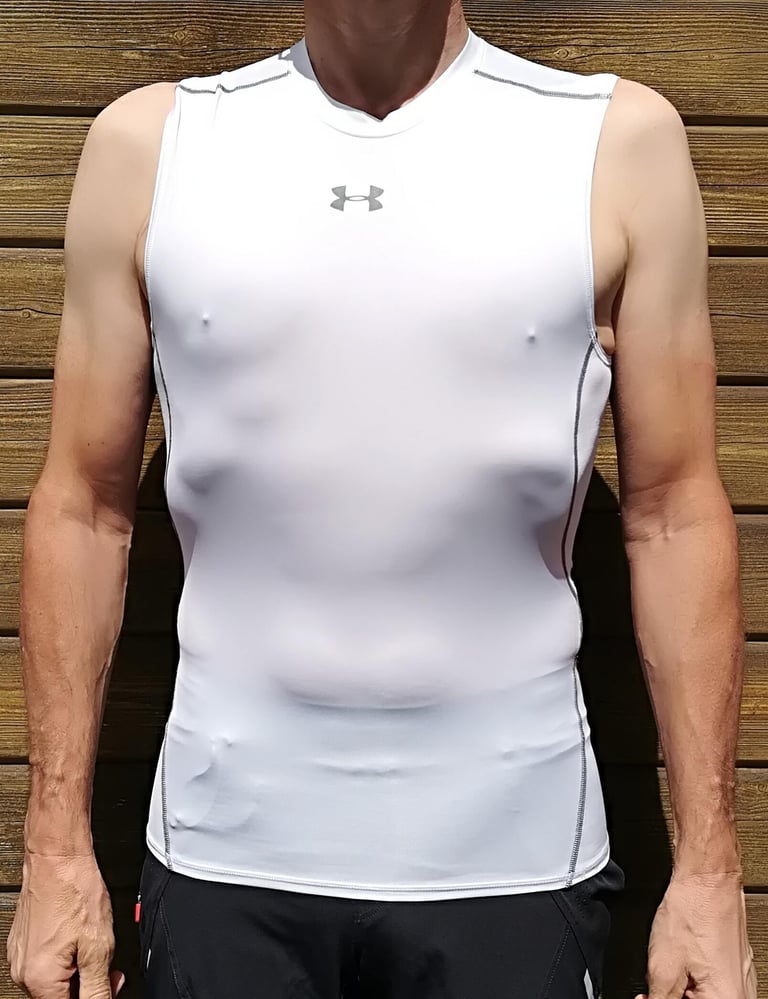 Under Armour Heatgear sleeveless compression base layer in white, a close-fitting non-mesh summer top.