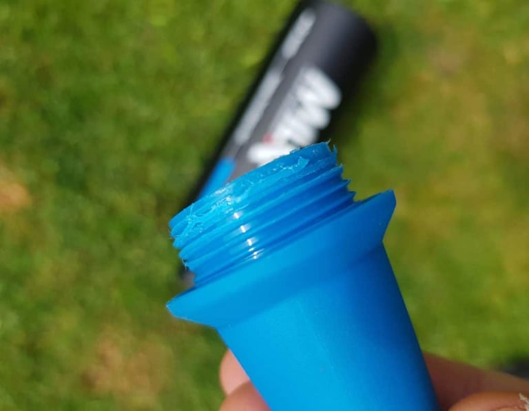 Damaged plastic thread on the blue MilKit Booster inflator head after it failed at around 100 psi.