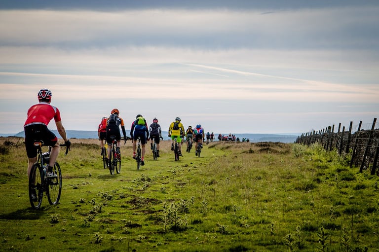 Yorkshire True Grit riders roll out in a long line across open moorland after leaving High Paradise Farm in Boltby.