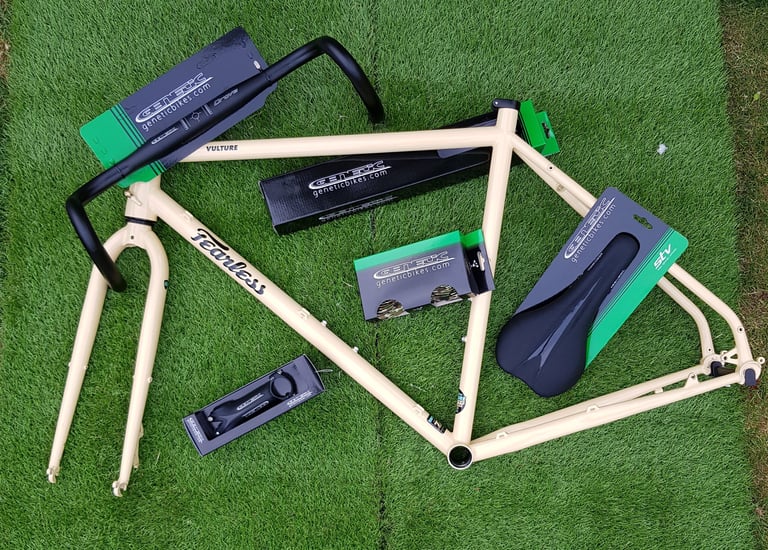 Fearless Vulture frameset on astroturf with Genetic Drove bars, STV saddle, stem and bar tape in their packaging.