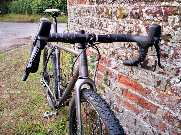 Bombtrack Hook EXT from the front, with flared drop bars, SRAM Rival hydraulic levers and a WTB Nano tyre.