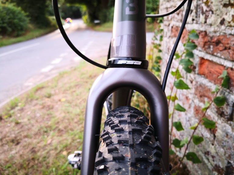 Front view of the Bombtrack Hook EXT fork and head tube with FSA headset and a 650b WTB Nano tyre.