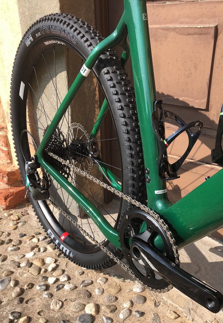 Rear triangle and drivetrain of the green 3T Exploro, with a 650b WTB Ranger 2.0 tyre and single chainring.