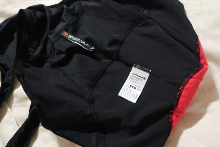 Inside of Endura FS260-Pro bibshorts showing flatlock seams and the white washing-instructions label.