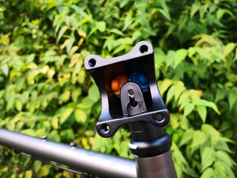 Redshift ShockStop stem with its face-plate removed, showing the orange and blue elastomers inside.