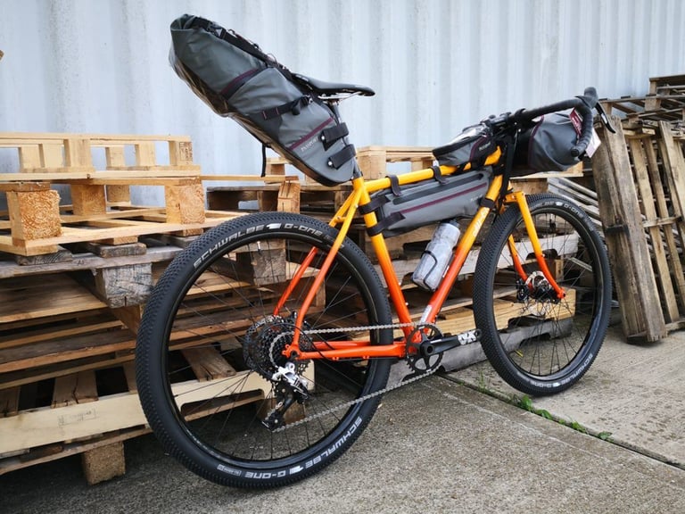 All-City Gorilla Monsoon test build with Passport bags and 2.25in Schwalbe G-One tyres, seen from the rear drive side.