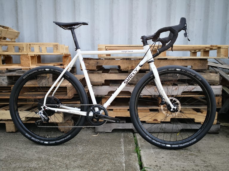 UK-spec Surly Midnight Special in white, side view, with SRAM 1x drivetrain and Schwalbe G-One tyres.