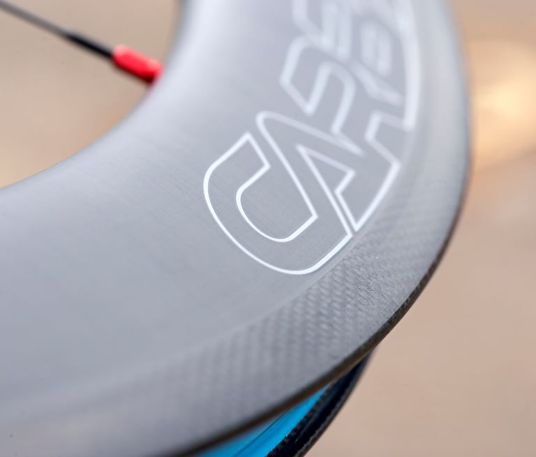 Macro view of the Carbaura rim decal and carbon weave edge on a Halo Carbaura RC wheel.
