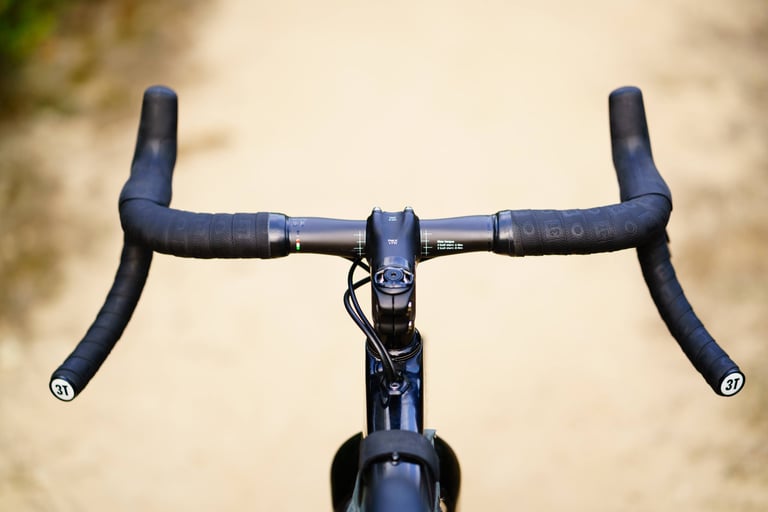 3T Superghiaia bars from above, showing the flat aero tops and the drops flaring out wider than the clamp area.