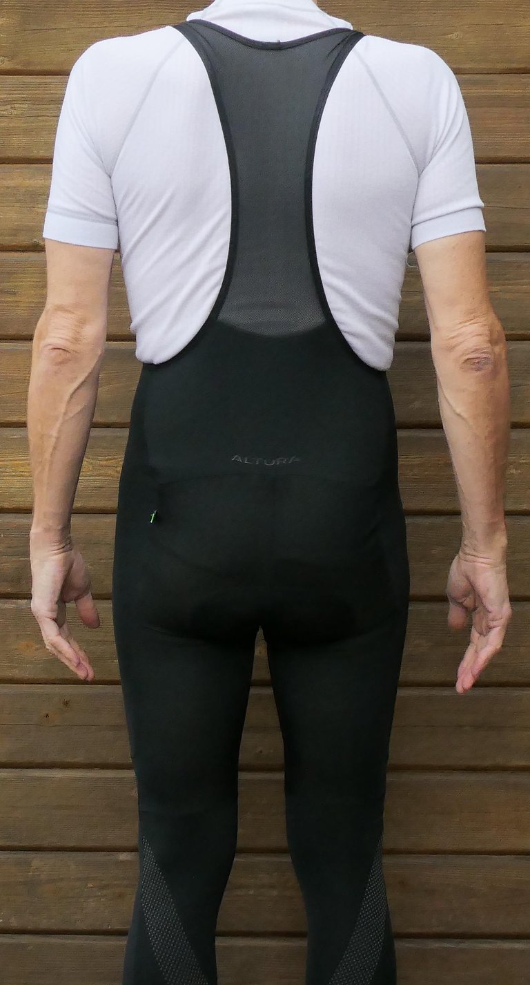 Rear view of the Altura Repel Bibtights, with mesh straps and reflective panels on the lower legs.