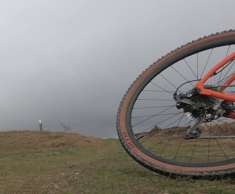 Rear wheel of the Mason Bokeh fitted with a WTB Sendero 47 tyre on open heathland under a grey sky.
