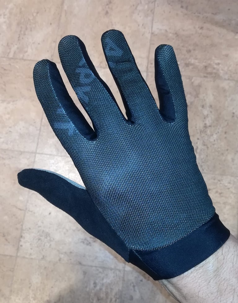 Back of the Alpkit Comet glove in dark blue, showing the breathable mesh upper and printed fingers.