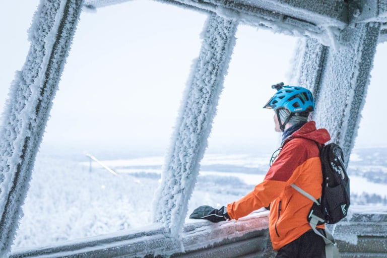 Nigel Leech looks out over the snowy forest from the frosted Tottorakka summit shelter near Rovaniemi.