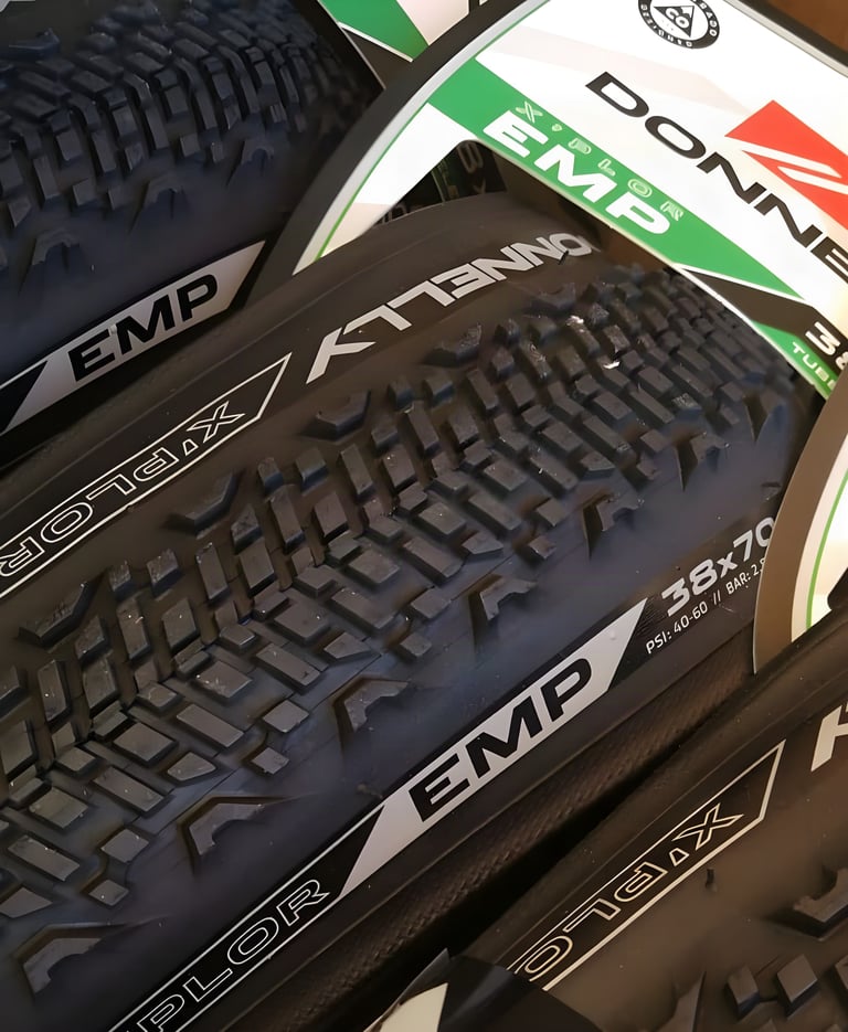 Stacked Donnelly X'Plor EMP 700x38 gravel tyres showing the tight centre tread and shoulder knobs at CoreBike 2019.