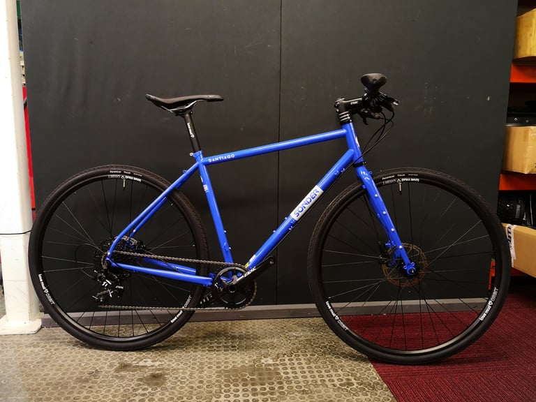 Blue Sonder Santiago flat-bar build with SRAM 1x, Panaracer tyres and Love Mud Orbit wheels, side view.