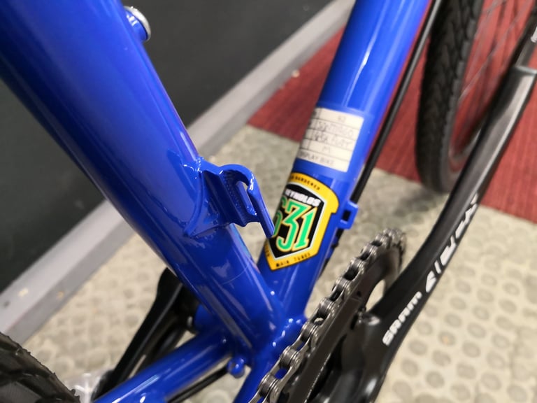 Reynolds 631 tubing sticker on the blue Sonder Santiago frame, near the bottom bracket.