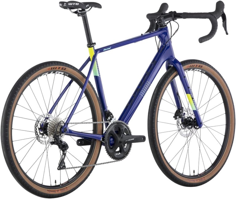 Rear three-quarter view of the blue Salsa Warroad Carbon 105 with Shimano 105 cranks and 650b wheels.