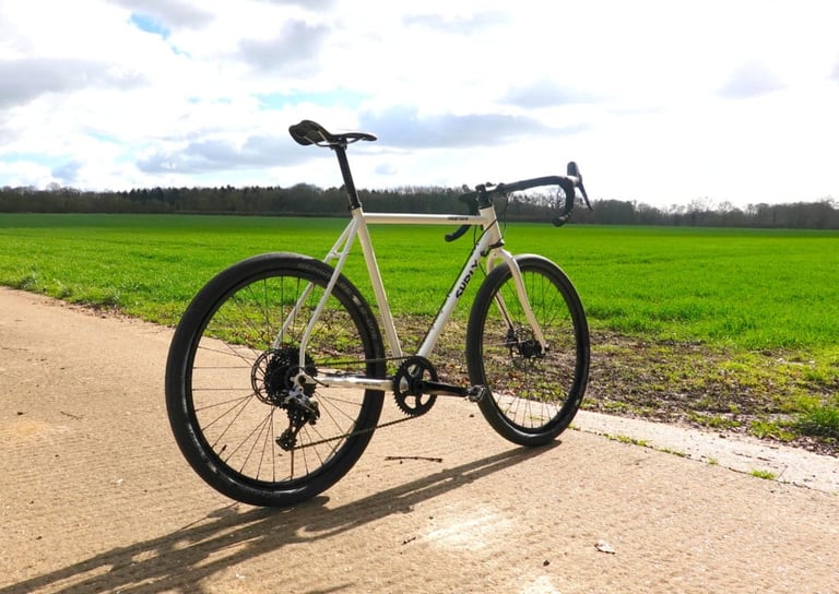 Rear three-quarter view of the Surly Midnight Special 1x HRD with its 1x chainring on a concrete track.