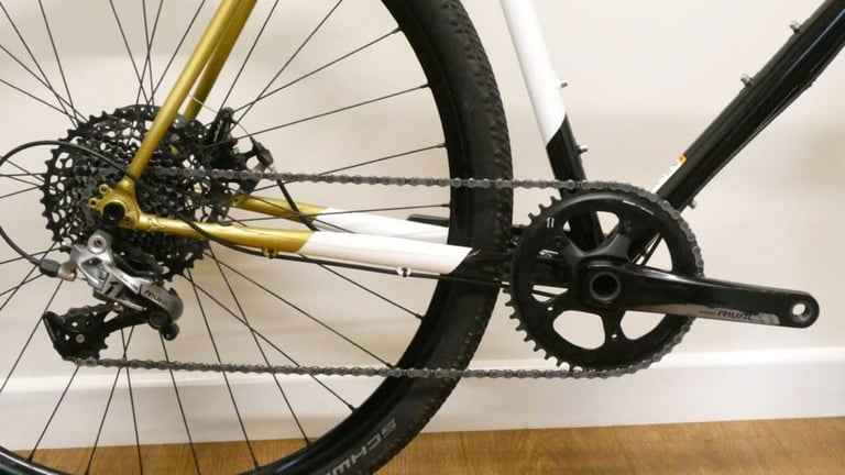 SRAM Rival 1x chainring, crank and rear derailleur on the Cosmic Stallion, with Schwalbe tyre behind.