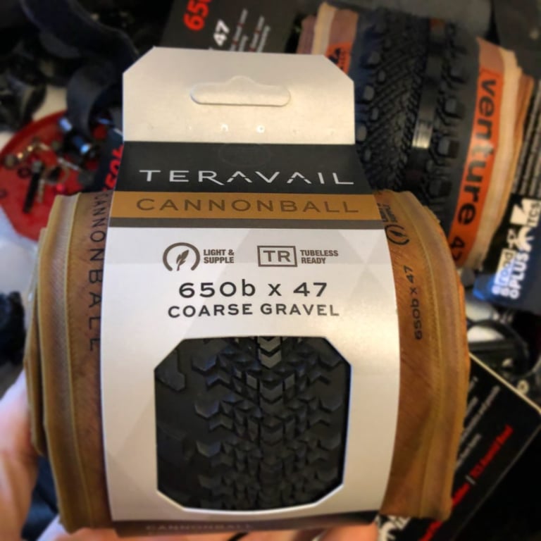 Teravail Cannonball 650b x 47 Light and Supple tyre in its packaging, with a tan sidewall and tubeless-ready label.