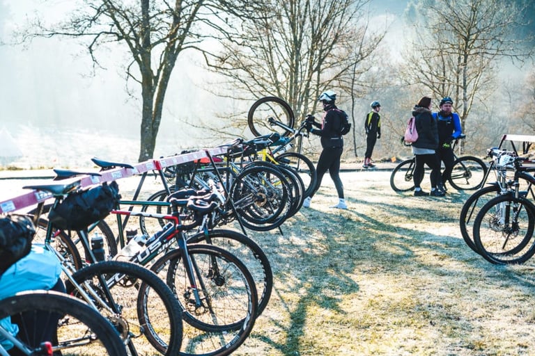 Bikes racked on frosty grass as riders prepare at the cold start of Dirty Reiver 2019.