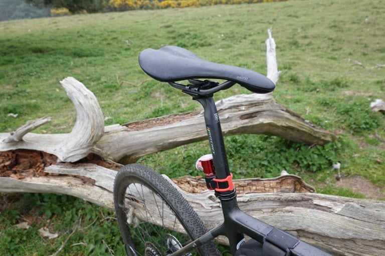 Ritchey WCS Carbon Link seatpost and Fabric Scoop saddle on the Bombtrack, with a rear light on the post.