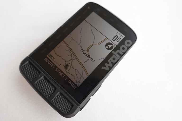 Wahoo ELEMNT ROAM map page showing roads and tracks near Broughton, with colour highlights on the route lines.