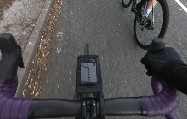 View over the bars of a Wahoo ELEMNT ROAM showing a route line as a rider tests it on the Yorkshire Dales loop.