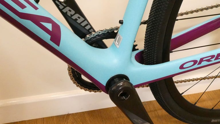 Orbea Terra bottom bracket shell and SRAM Force crank arm, with the rear tyre close to the frame.