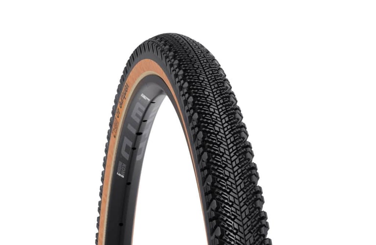 WTB Venture 700c x 40 tyre with tan sidewall, three-quarter studio view on white.