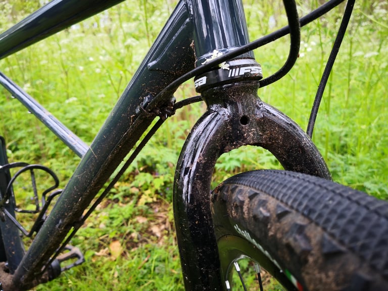 Mud-spattered BiViBIKES Femur fork crown with FSA headset and generous tyre clearance.