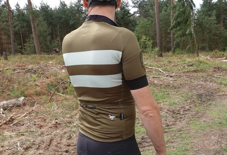 Back of the Blackmore Cadet jersey showing the striped panel, rear pockets and small duck motif.